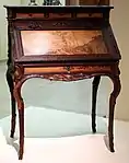 Desk (Art Nouveau), presented at the 1900 Paris Exposition; by Émile Gallé; 1900; molded and carved oak, with chiseled and patinated bronze; height: 108.5&nbsp;cm; Musée d'Orsay (Paris)
