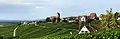 &nbsp;Panoramic view of Ötlingen from the southeast; the hilly landscape is typical for the region of Markgräflerland