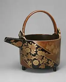 Sake Ewer with Chrysanthemums and Paulownia Crests in Alternating Fields. early 17th century, Azuchi–Momoyama period