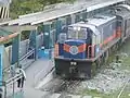 918 wearing the MRail Blue-orange livery at EDSA Station.