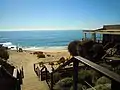 The steps down to the beach. The wooden board walk runs off to the beach bar and restaurant to the right.