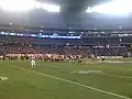 Northern Illinois Huskies (in red) vs South Florida Bulls (in white)