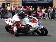 2013 Isle of Man TT&nbsp; TT Zero Practice Session Mark Miller (2) MotoCzysz E1pc at Parliament Square, Ramsey 3 June 2013.