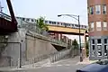 A CTA Blue Line elevated train crossing over the trail near Milwaukee Avenue