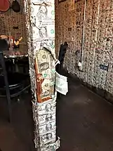 The walls of the Saloon are papered with dollar bills