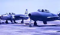 Republic F-84G-2-RE Thunderjet 51-9674 of the 492nd FBS, alongside a 492nd FBS F-84G in a experimental camouflage motif, 1954.
