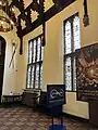 The hall: stained glass windows on east wall.
