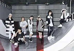 AAA in 2015
 From left to right: Naoya Urata, Shinjiro Atae, Misako Uno, Mitsuhiro Hidaka, Chiaki Ito, Takahiro Nishijima and Shuta Sueyoshi