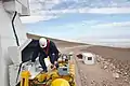 A worker inspects a transporter.