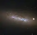 NGC 4248 is located about 24&nbsp;million light-years away.