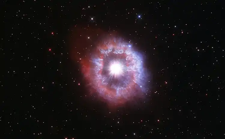 This Hubble Space Telescope anniversary image shows AG Carinae waging a tug of war between gravity and radiation to avoid self-destruction.
