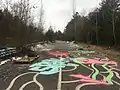 Looking south at the abandoned section of Interstate with a makeshift skate park and graffiti