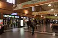 Main passenger concourse and ticket barriers in 2010. The barriers were later updated to allow the use of Metrocards.