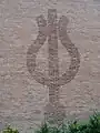 Stylized Neptune symbol (orb base)