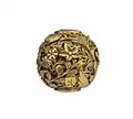 A Meiji gilt bronze pearl-inlaid ojime