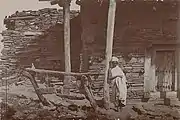 Ancient Axumite church built in the 6th century here are the typical details of the Axumite buildings, basaltic stone bells still in use in many Eritrean churches, Coptic priest (the photo was taken in 1909) 2