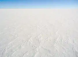 aerial view of ice sheet covered in snow Antarctica