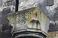 Capital in the gavit with cross carvings