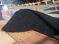 Image 79Pile of asphalt-covered aggregate for formation into asphalt concrete (from Oil refinery)