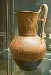 a late geometric Attic jug, with bands of repeating patterns