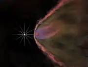 Depiction of the same pulsar one million times closer showing the effect of its wind on its companion star, which is evaporating.  The bow shock is too large to be shown, and at this scale would extend more than 15 miles (24&nbsp;km) beyond the edge of the computer screen.