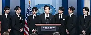 BTS at the White House in 2022 (left to right):V, Jungkook, Jimin, RM, Jin, J-Hope, and Suga