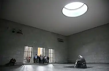 Image 7Neue WachePhoto credit: Daniel SchwenThe interior of the Neue Wache, the central memorial of Germany for victims of war and tyranny. Located in Berlin, the building was originally built as a guardhouse, and has been used as a war memorial since 1931. The statue, Mother with her Dead Son is directly under the oculus, and so is exposed to the rain, snow and cold, symbolising the suffering of civilians during World War II.