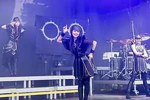Babymetal performing at Rock am Ring in 2018; Su-metal at left and Moametal at center