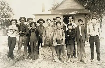 Image 3Photograph of glassworkers by Lewis HinePhotograph: Lewis Hine; restoration: Lise BroerA baseball team composed mostly of child laborers from an Indiana glassmaking factory, as photographed by Lewis Hine in August 1908. Hine (1874–1940) was an American sociologist who promoted the use of photography as an educational medium and means for social change. Beginning in 1908, he spent ten years photographing child labor for the National Child Labor Committee. The project was a dangerous one, and Hine had to disguise himself – at times as a fire inspector, post card vendor, Bible salesman or industrial photographer – to avoid the factory police and foremen.More featured pictures