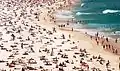 The beach, with numerous sunbathers