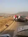 Muslim beggars stalk a car in Nigeria.