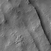 Biblis Patera pedestal crater, as seen by HiRISE.
