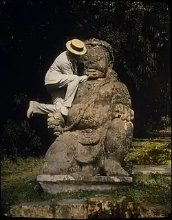 Image 18BorobudurPhoto: William Henry Jackson; Restoration: Lise BroerA man climbs a statue of a Buddhist idol at Borobudur, a 9th-century Mahayana Buddhist monument near Magelang, Central Java, Indonesia, in this 1895 hand-tinted lantern slide. The monument comprises six square platforms topped by three circular platforms, and is decorated with 2,672 relief panels and 504 Buddha statues. The monument is both a shrine to the Lord Buddha and a place for Buddhist pilgrimage. Evidence suggests Borobudur was abandoned following the 14th-century decline of Buddhist and Hindu kingdoms in Java, and the Javanese conversion to Islam. The monument is a UNESCO World Heritage Site and is the most popular tourist attraction in the country.More featured pictures