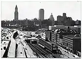 Late 1960s view from the north, with the elevated Central Artery at left.  What remains of Haymarket Square is the traffic circle at the center.