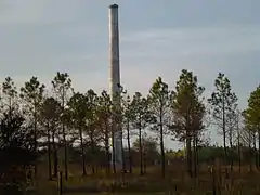 Abandoned smokestack in the defunct town of Brewster, the line's namesake