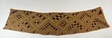 Cloth; raffia; 20.3 x 85.7&nbsp;cm (8 x 33.mw-parser-output .frac{white-space:nowrap}.mw-parser-output .frac .num,.mw-parser-output .frac .den{font-size:80%;line-height:0;vertical-align:super}.mw-parser-output .frac .den{vertical-align:sub}.mw-parser-output .sr-only{border:0;clip:rect(0,0,0,0);clip-path:polygon(0px 0px,0px 0px,0px 0px);height:1px;margin:-1px;overflow:hidden;padding:0;position:absolute;width:1px}3⁄4 in.); Brooklyn Museum. In Kuba culture, men are responsible for raffia palm cultivation and the weaving of raffia cloth. Several types of raffia cloth are produced for different purposes, the most common form of which is a plain woven cloth that is used as the foundation for decorated textile production