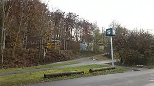 Asphalt paths leading up to a side platfrom