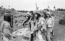 Image 18Eastern German reenacters at an Indianistikmeeting in Schwerin, 1982. The popular image of Native Americans made Native American living history quite popular in East Germany. (from Culture of East Germany)