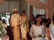 Image 15A wedding procession, with the groom and bride dressed in traditional Burmese wedding clothes, reminiscent of royal attire. (from Culture of Myanmar)