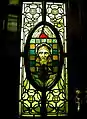 Committee room door panel: Viking-like holy face, made 1901