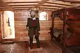 Replica of Nao Victoria, Magellan in its cabin.