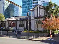 Italianate building in front of modern high rises