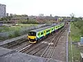 150009 heading south towards Walsall station, with a service from Rugeley Town.