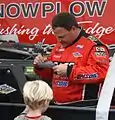 Signing autographs for a kid in 2011