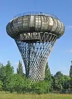 The Ciechanów water tower is a toroidal water tower tank on a doubly ruled hyperboloid structure, Ciechanów, Poland, 1972.