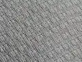 Closeup of gold weave pattern on an OTM blank white gi.