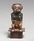 Male figure-shaped coca chewer on bench; 9th–15th century; ceramic; height: 21.6&nbsp;cm (8.mw-parser-output .frac{white-space:nowrap}.mw-parser-output .frac .num,.mw-parser-output .frac .den{font-size:80%;line-height:0;vertical-align:super}.mw-parser-output .frac .den{vertical-align:sub}.mw-parser-output .sr-only{border:0;clip:rect(0,0,0,0);clip-path:polygon(0px 0px,0px 0px,0px 0px);height:1px;margin:-1px;overflow:hidden;padding:0;position:absolute;width:1px}1⁄2 in.), width: 10.2&nbsp;cm (4 in.); Metropolitan Museum of Art