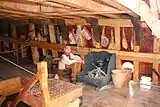 Replica of Nao Victoria, cook at the stove.