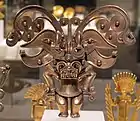 Anthropomorphic pendant; 1000–1550; gold alloy casting; width: 14.6&nbsp;cm (5.mw-parser-output .frac{white-space:nowrap}.mw-parser-output .frac .num,.mw-parser-output .frac .den{font-size:80%;line-height:0;vertical-align:super}.mw-parser-output .frac .den{vertical-align:sub}.mw-parser-output .sr-only{border:0;clip:rect(0,0,0,0);clip-path:polygon(0px 0px,0px 0px,0px 0px);height:1px;margin:-1px;overflow:hidden;padding:0;position:absolute;width:1px}3⁄4 in.); Metropolitan Museum of Art (New York City)