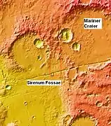 MOLA context image for the series of three images to follow of gullies in a trough and nearby crater.  This image shows where the image is in relation to Mariner Crater and Sirenum Fossae.
